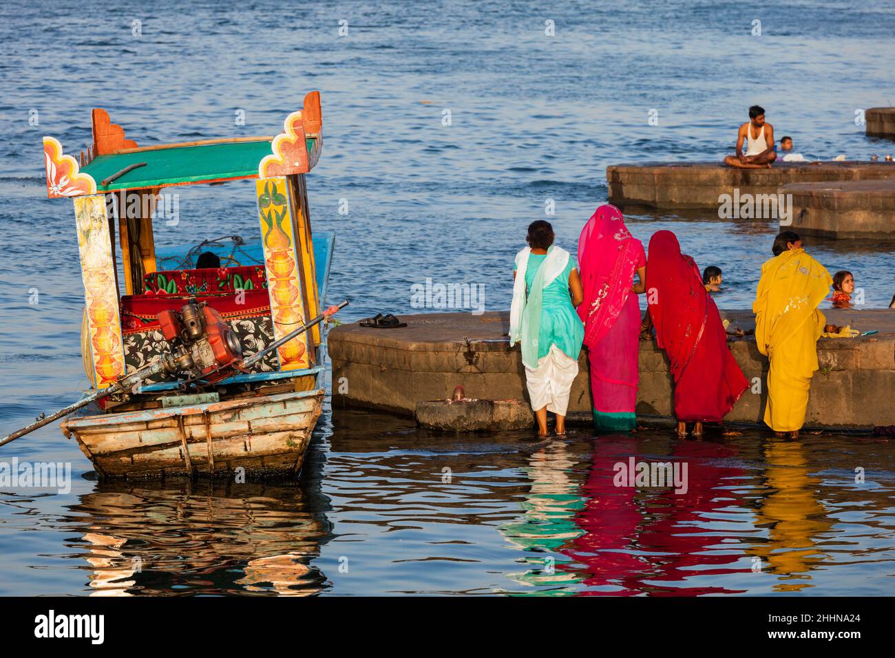 Women doing morning pooja Stock Photo