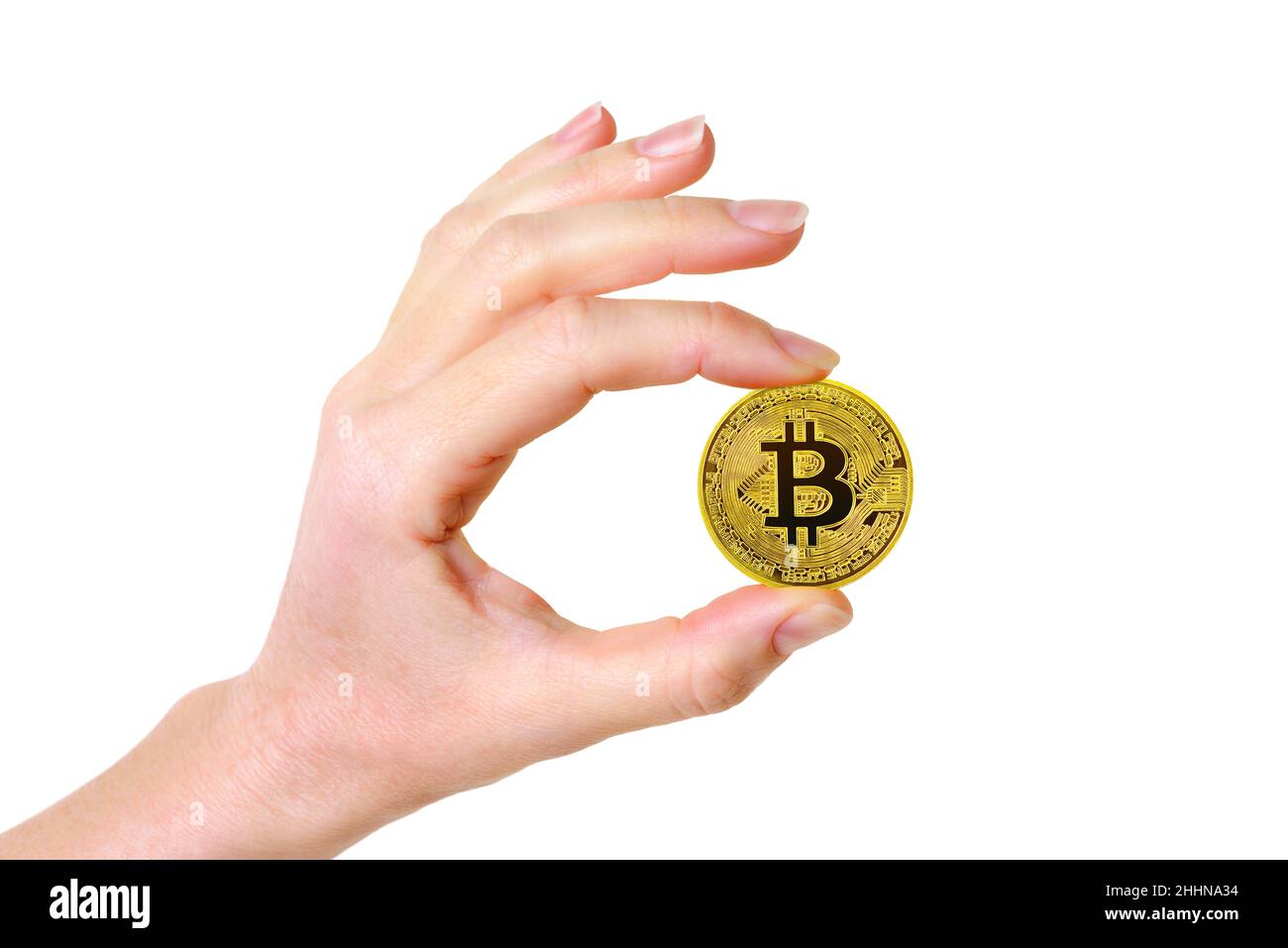 Bitcoin Cryptocurrency Coin Held Between a Womans Fingers Stock Photo