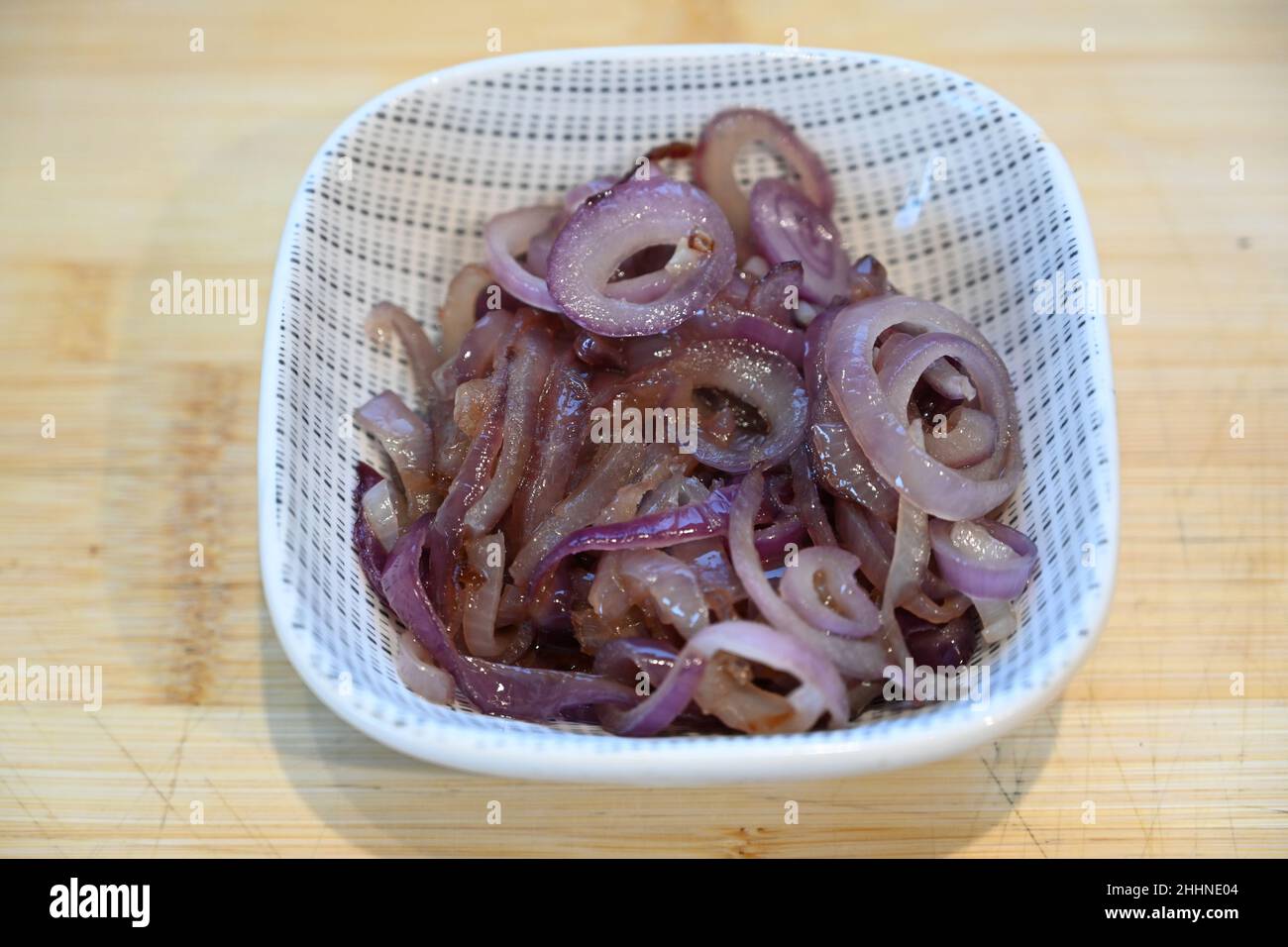 slow fried caramelised red onions, cooking ingredients, food preparation Stock Photo