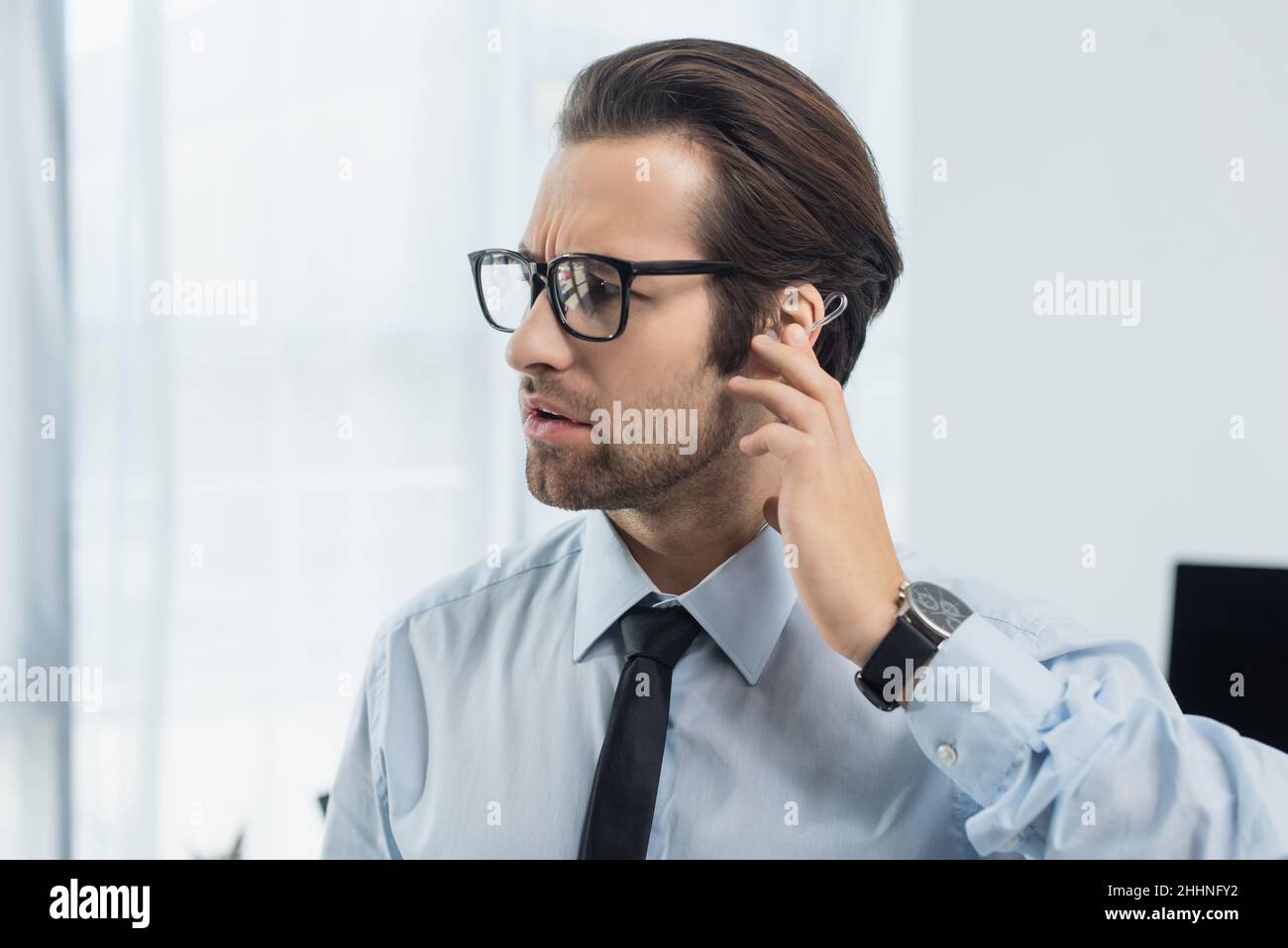 Serious man touching one hi-res stock photography and images - Alamy