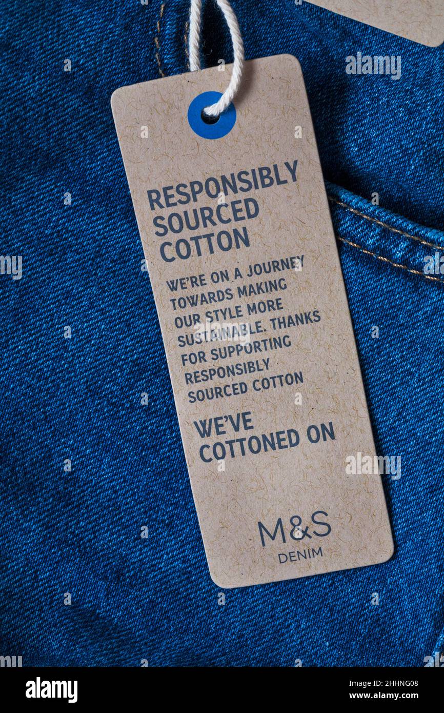 Blank Paper Label Tag On Blue Jeans Stock Photo, Picture and Royalty Free  Image. Image 23477705.