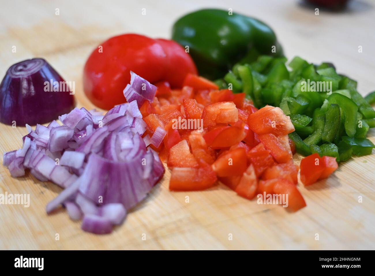 chopped peppers and onions, food preparation, cooking in the kitchen Stock Photo Alamy