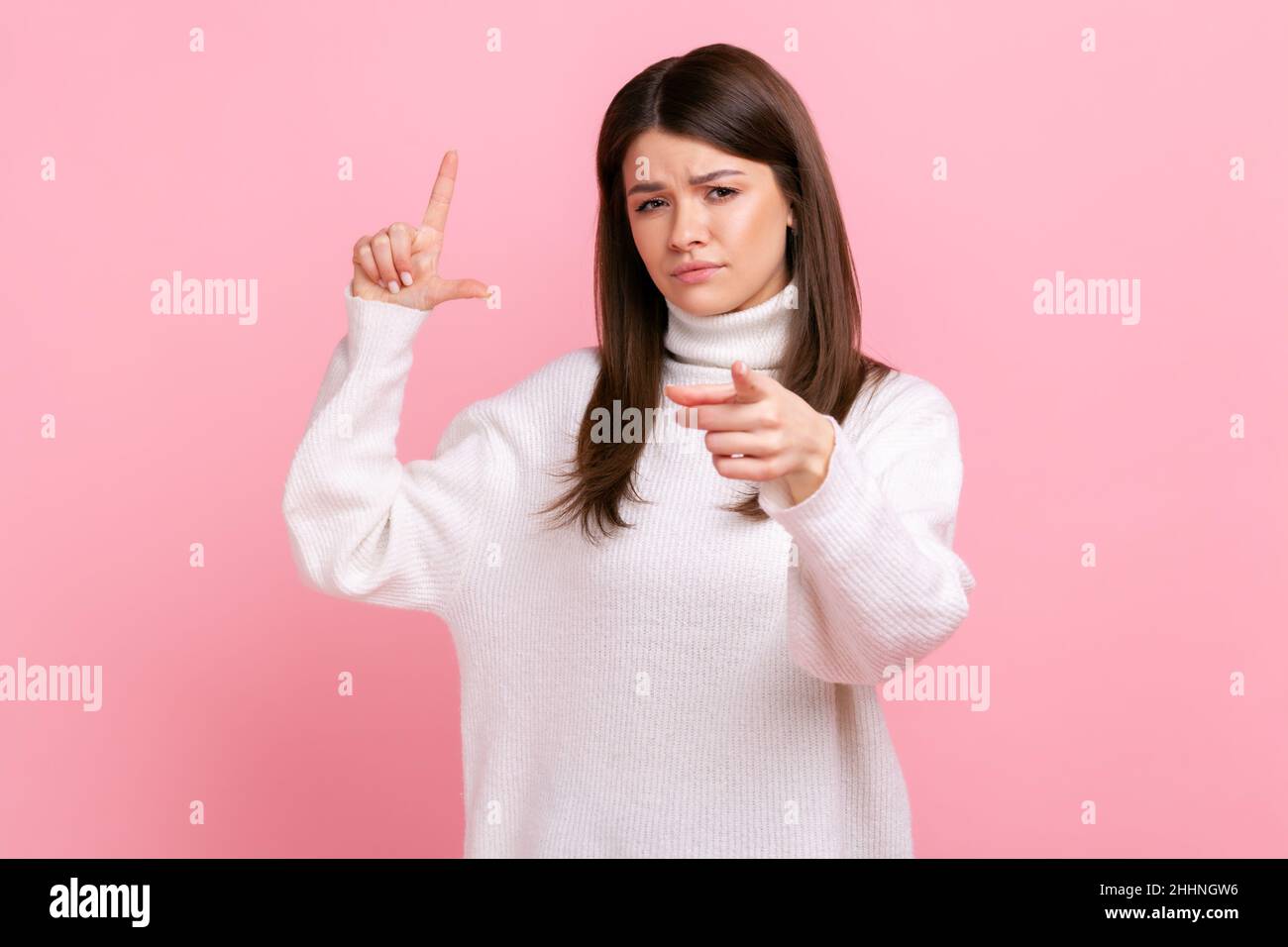 woman-expressing-disrespect-showing-l-finger-sign-to-camera-loser