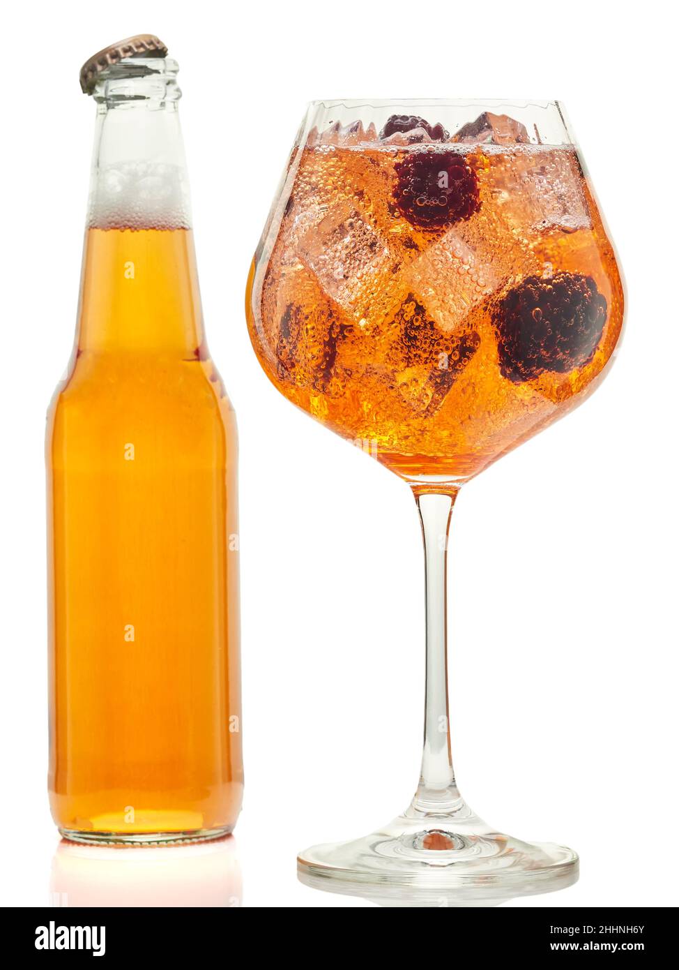 A bottle and a glass of blackberry-flavored apple cider, on a white background Stock Photo