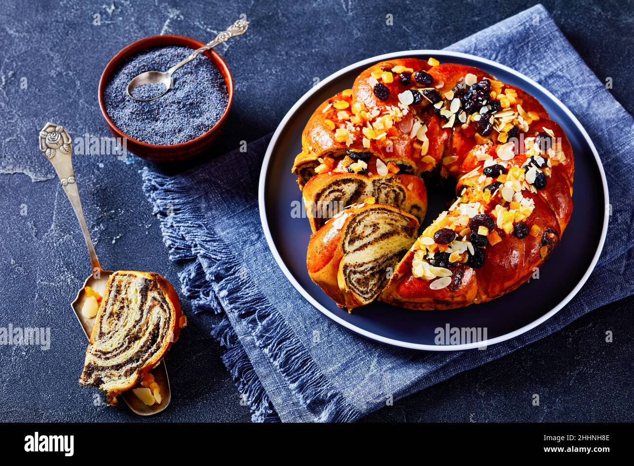 Braided sweet brioche Bread with poppy seeds filling sprinkled with