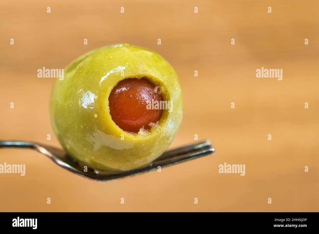 Stuffed olive in wooden background, studio shot Stock Photo Alamy