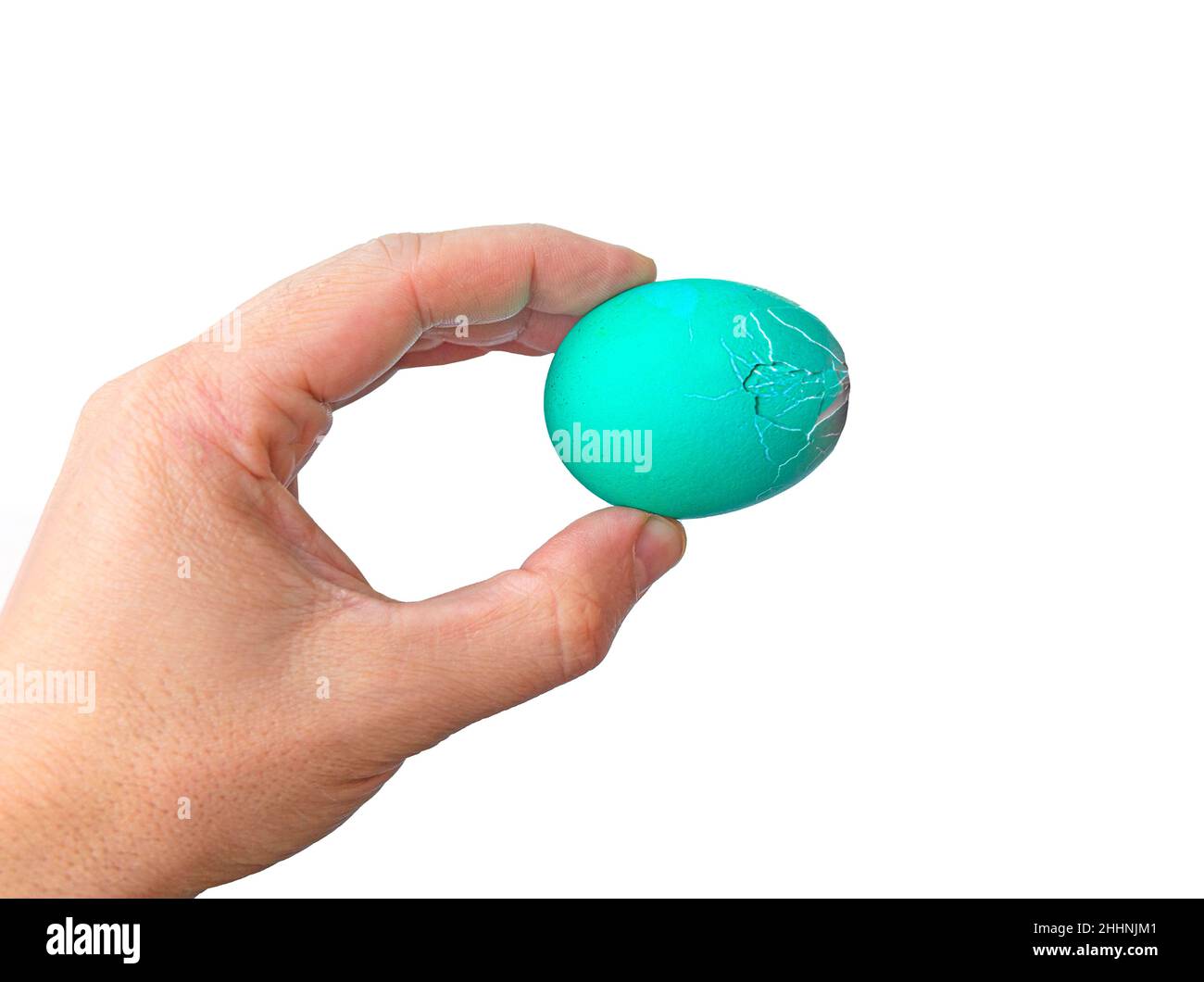 Unrecognizable men hand holding up for eggs. Knocking a red Easter egg. Old holiday tradition. Isolated on white background. Happy Easter Stock Photo