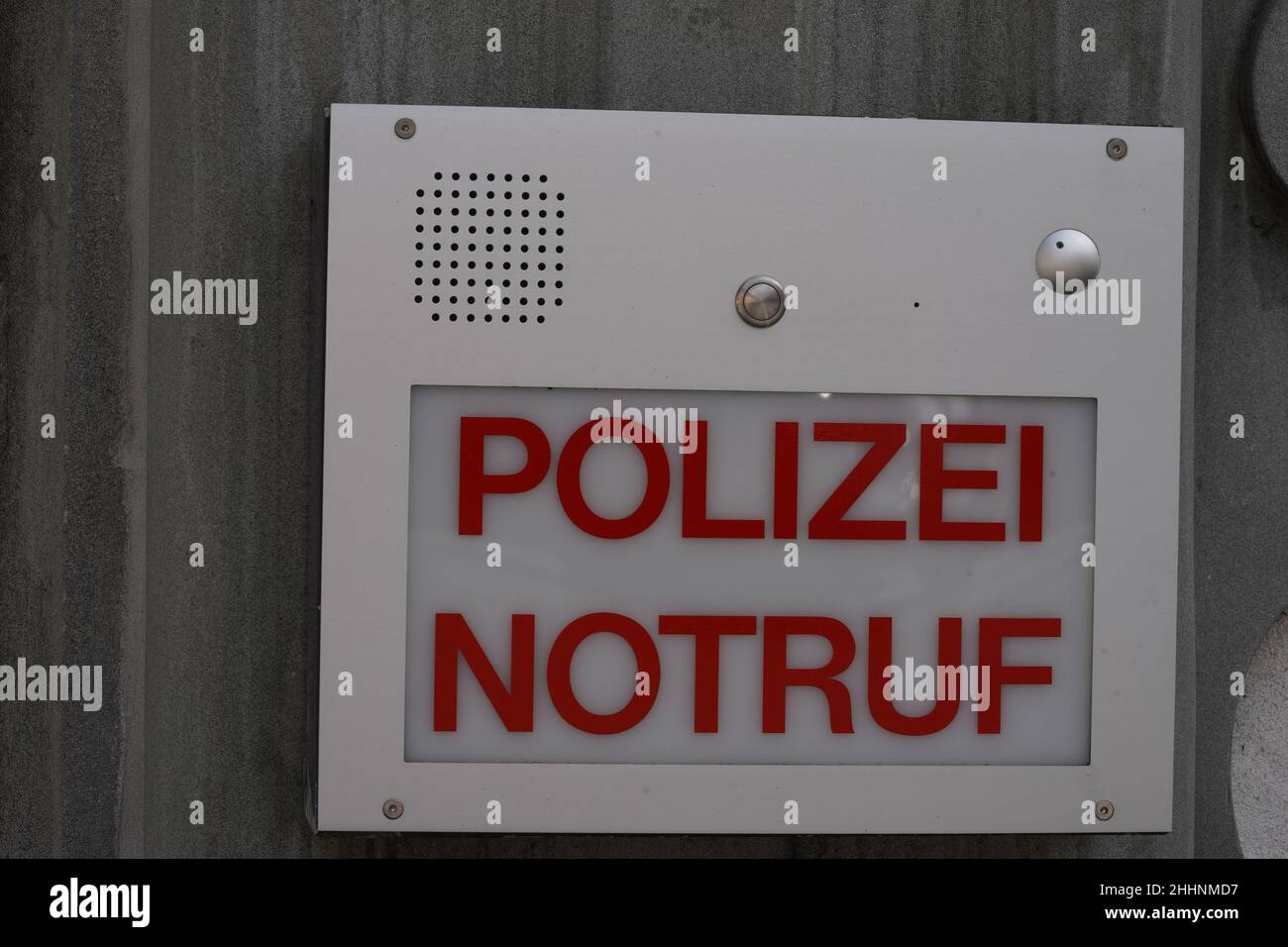 Intercom call box with inscription in German saying police emergency, in capital letters in red color. Stock Photo