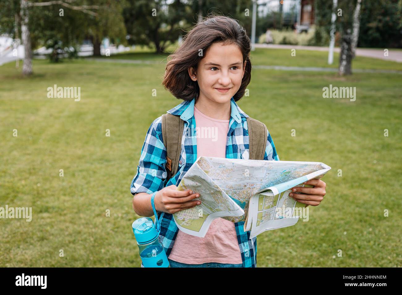 Cute teen girl travels in summer vacation. Hipster young girl with a