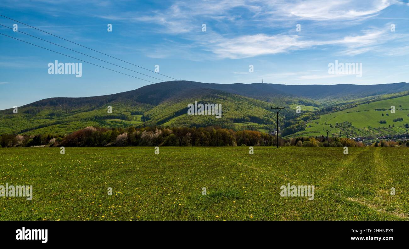 Kvetna settlement with Velka Javorina hill above from Nova hora hiill in springtime Bile Karpaty mountains in Czech republic Stock Photo