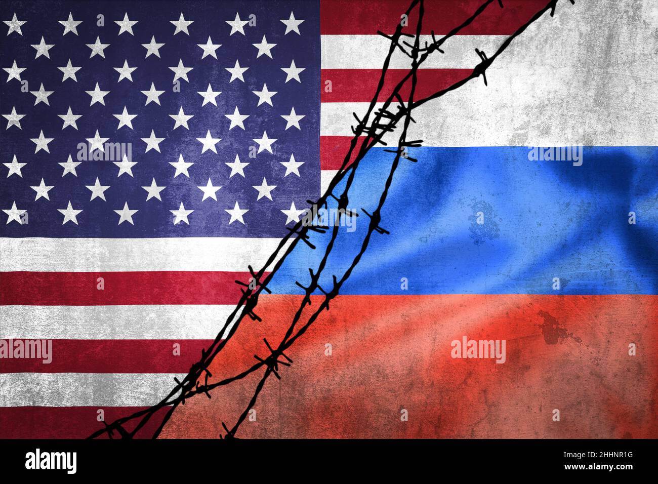 Grunge flags of Russian Federation and USA divided by barb wire illustration, concept of tense relations between west and Russia Stock Photo