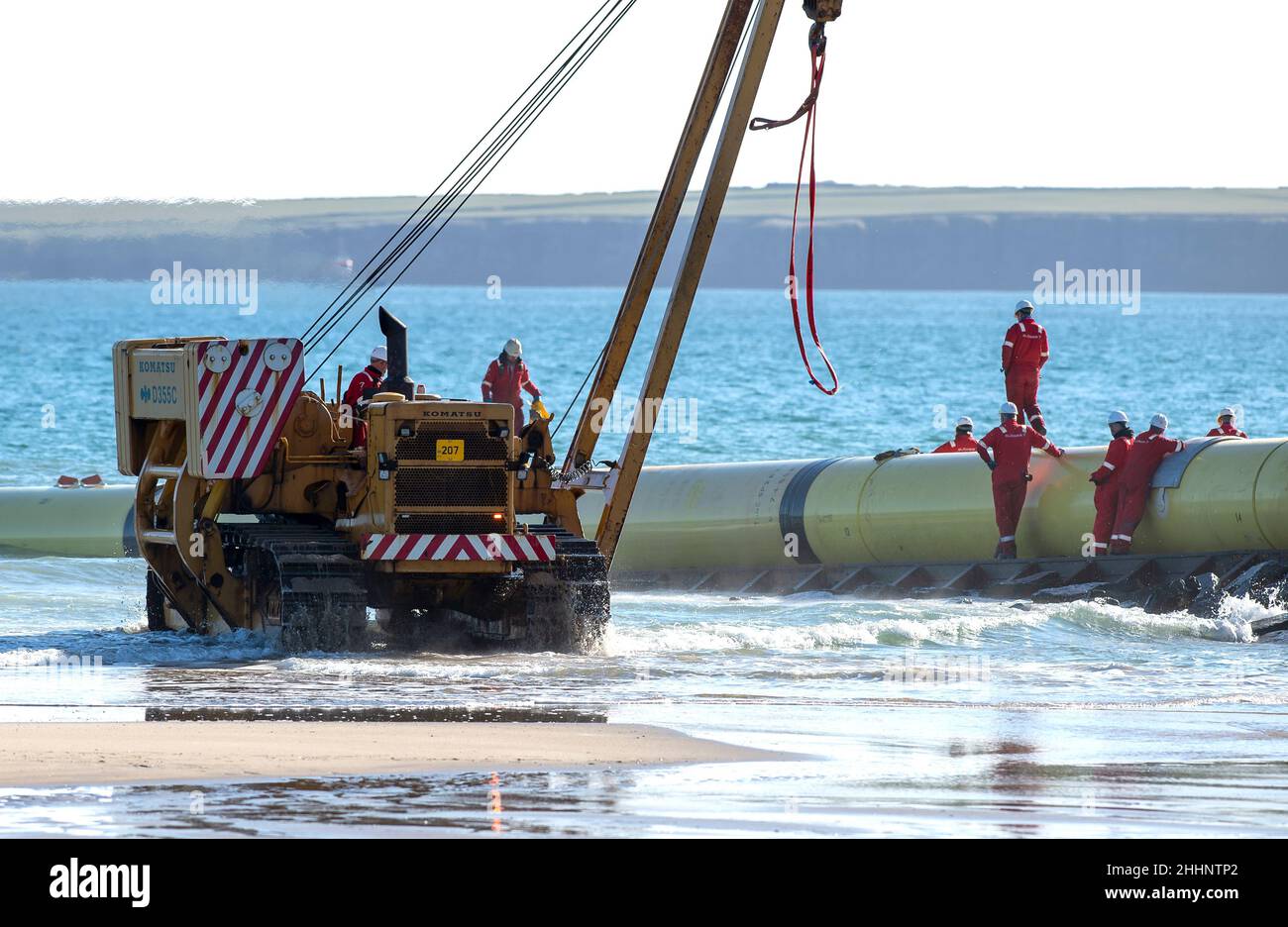 Launch of undersea pipe line to tow boat Stock Photo Alamy
