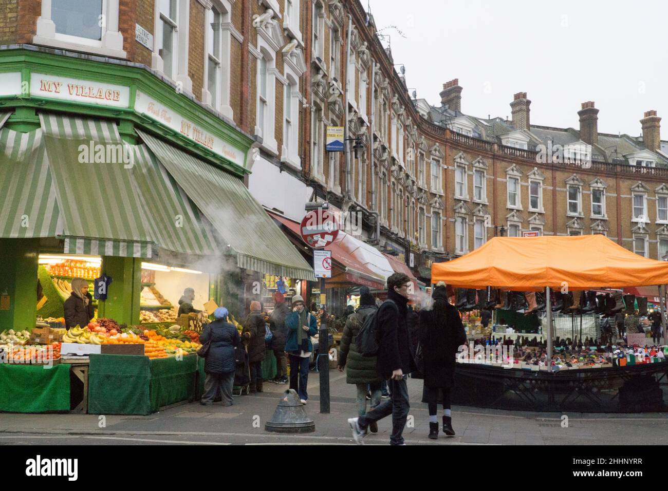 London, UK, 25 January 2022: On Electric Avenue in Brixton people buy groceries from shops and market stalls that cater to the diversity of the local population. The cost of basic foods has risen sharply and there are fears of how the cost of living crisis will affect poorer households all around the country. Anna Watson/Alamy Live News Stock Photo