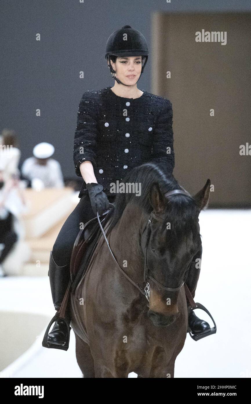 Charlotte Casiraghi rides a horse during the runway during the Chanel