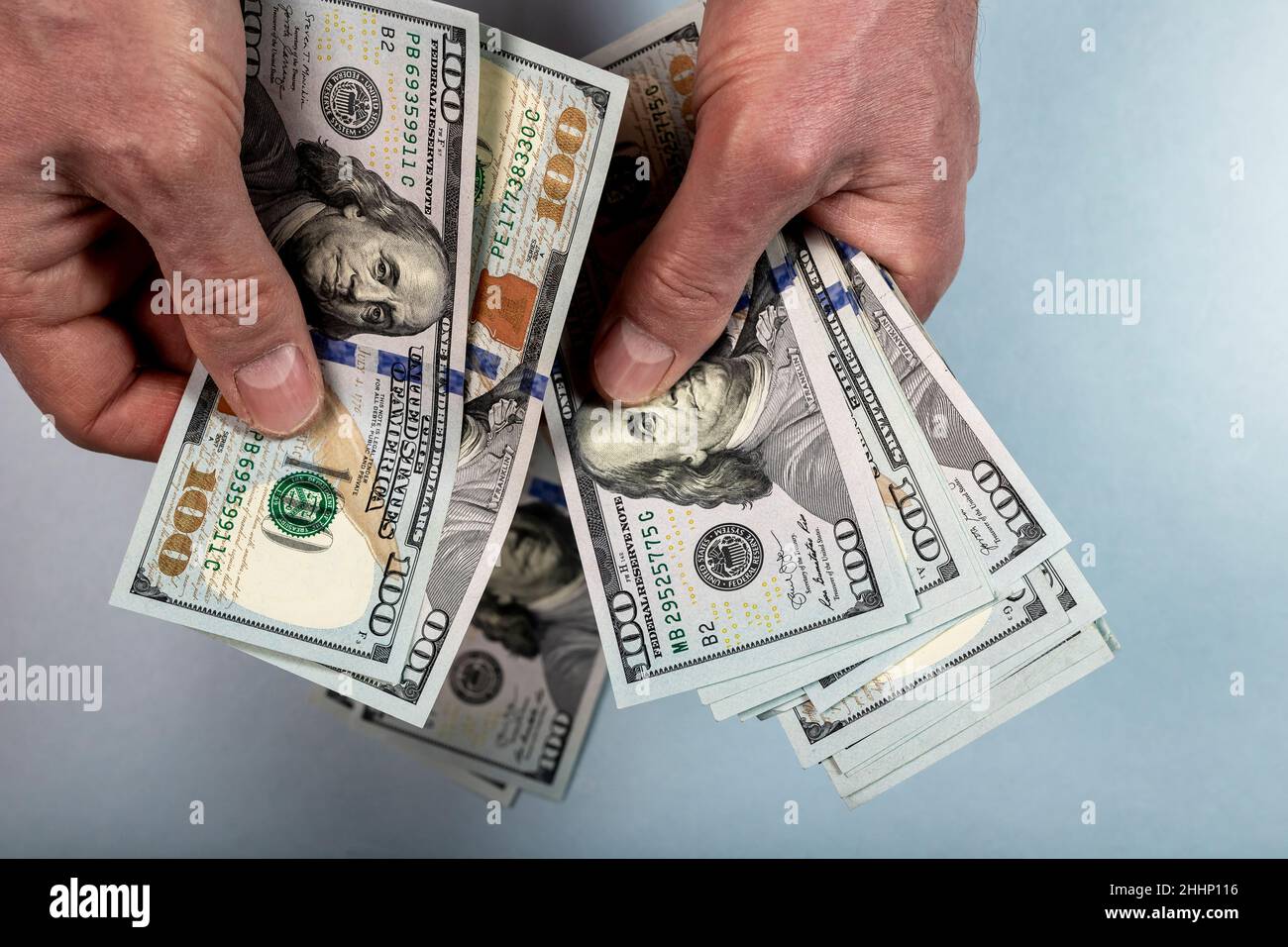 Hands counting paper money, US dollars. Holding paper money Stock Photo
