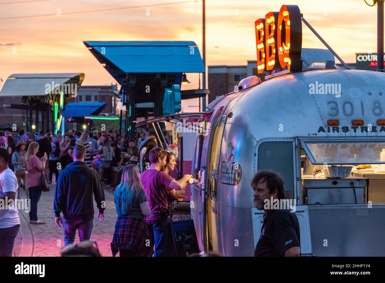 Ordering BBQ from an Airstream food truck at the Creative South Bridge Party on the Pedestrian Bridge crossing the Chattahoochee in Columbus, GA. Stock Photo