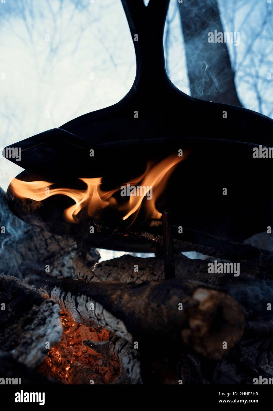 Cooking outdoors over fire Stock Photo