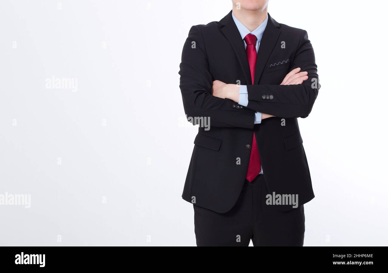 Businessman in black suit and crossed arms isolated on white background ...