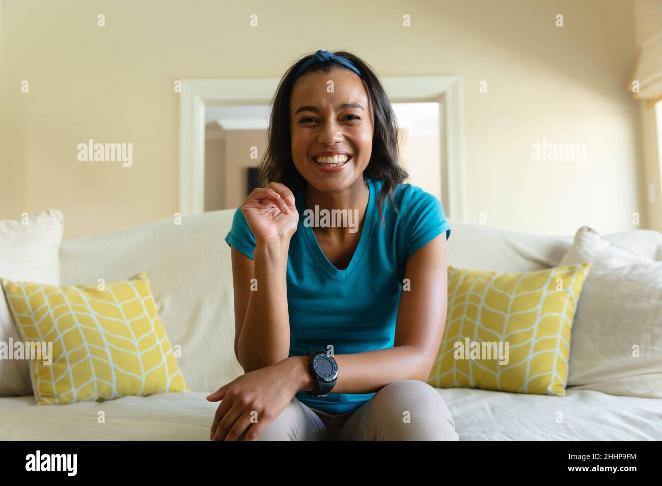 Portrait of happy beautiful young african american woman sitting on ...