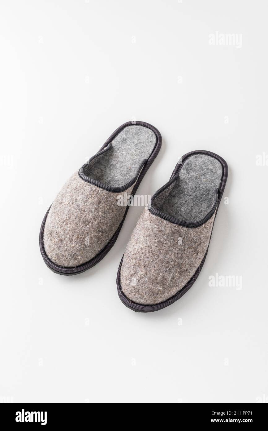 Men's felt slippers. Home shoes made of felted wool Stock Photo