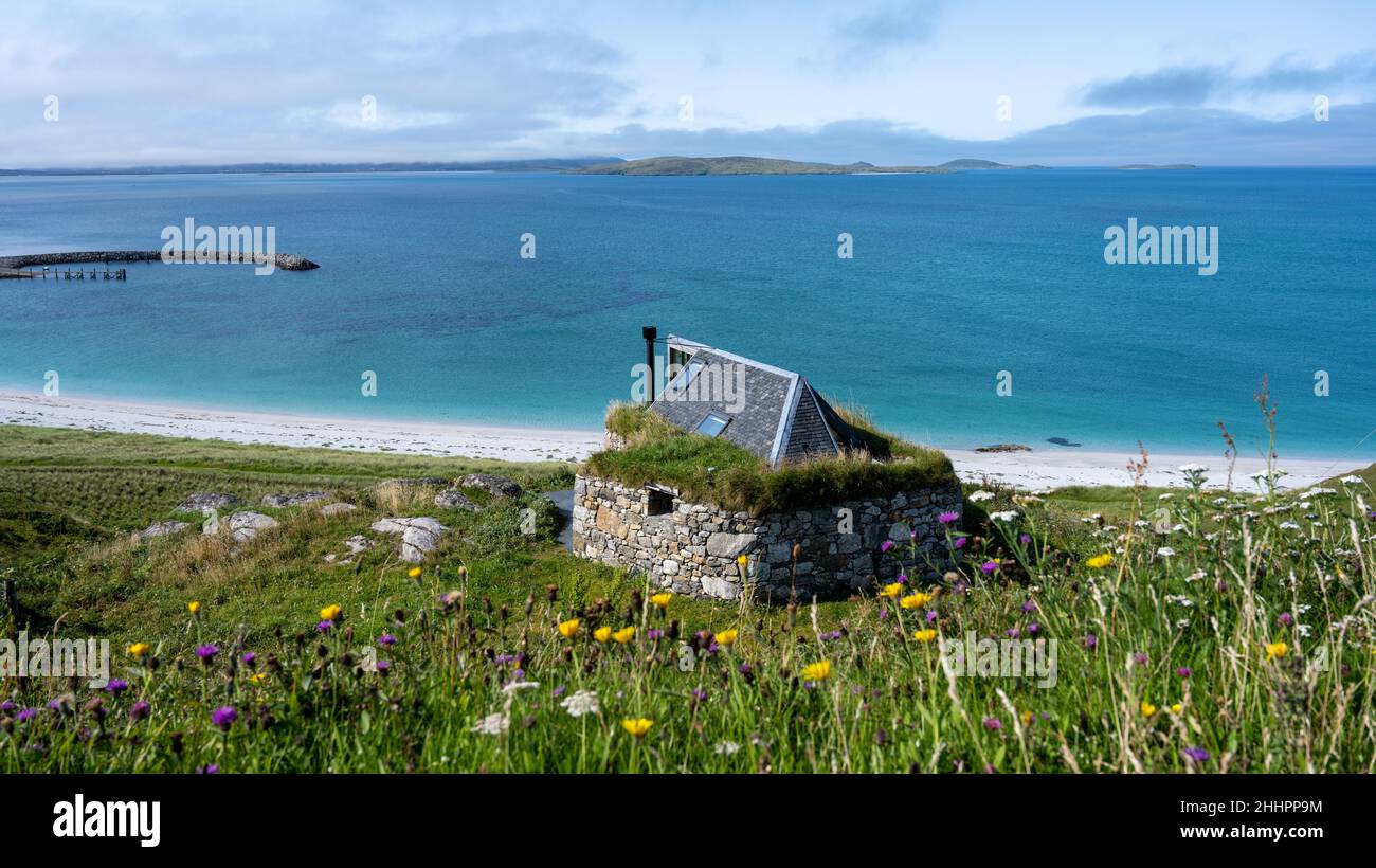View towards Eriskay Ferry Terminal with a house built on the