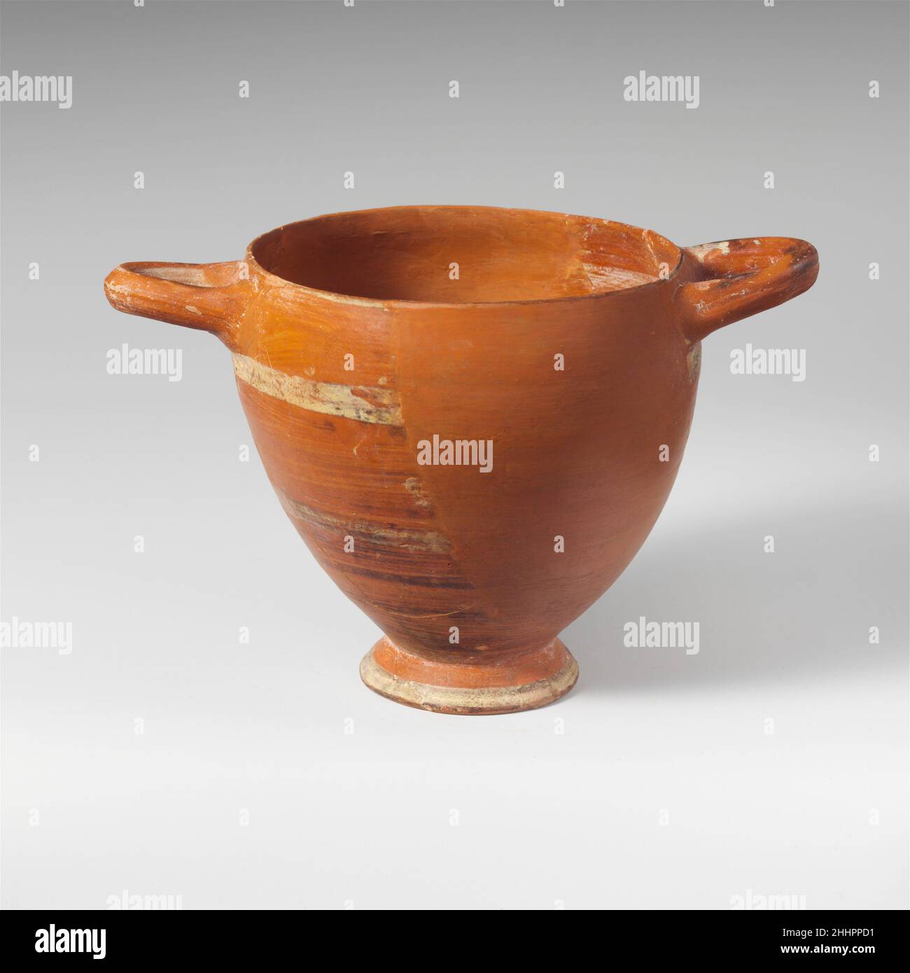 Terracotta skyphos (deep drinking cup) 6th century B.C. Lydian Red ware with horizontal bands of white.. Terracotta skyphos (deep drinking cup)  249080 Stock Photo