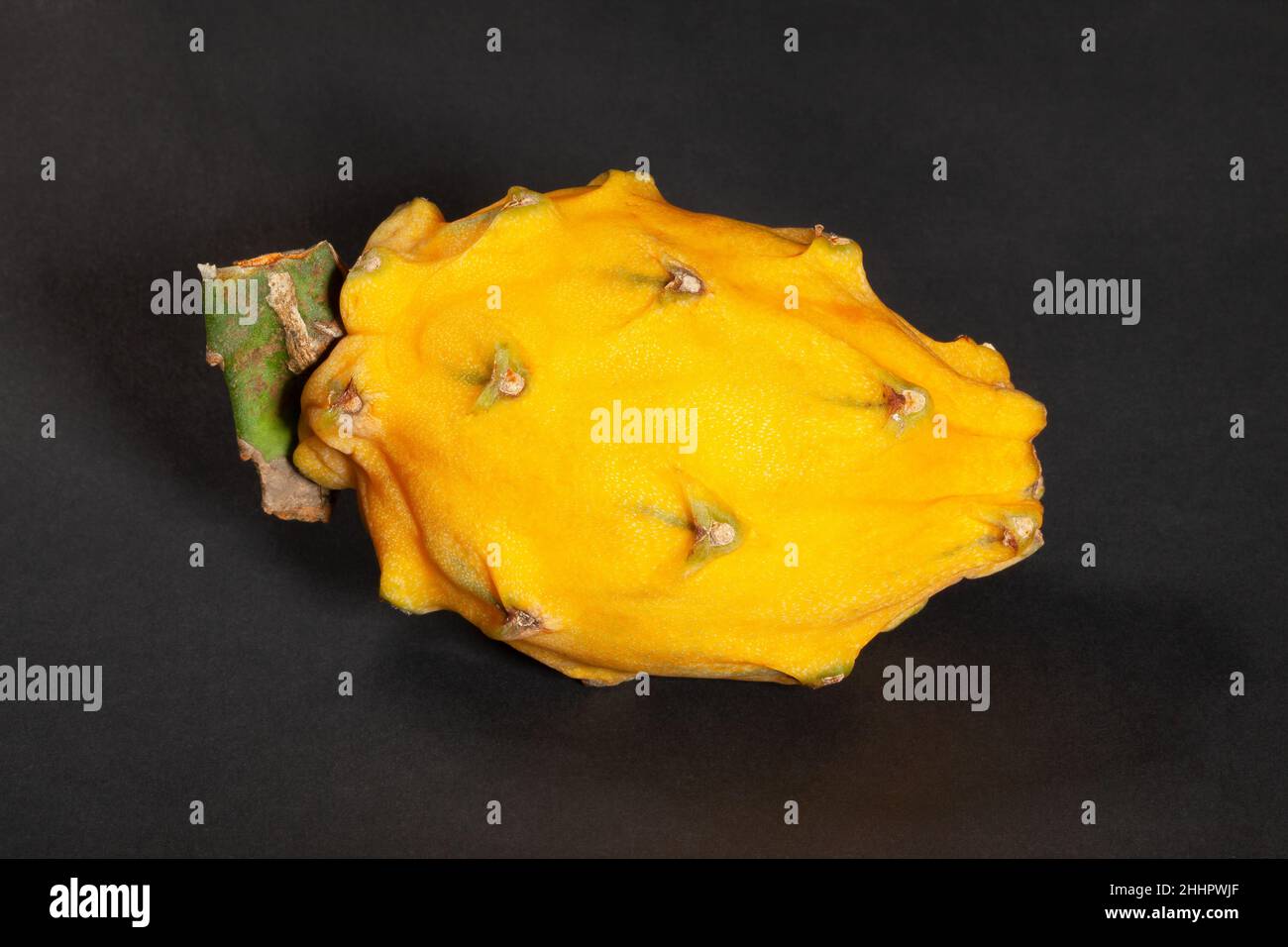 yellow dragon fruit on black background Stock Photo