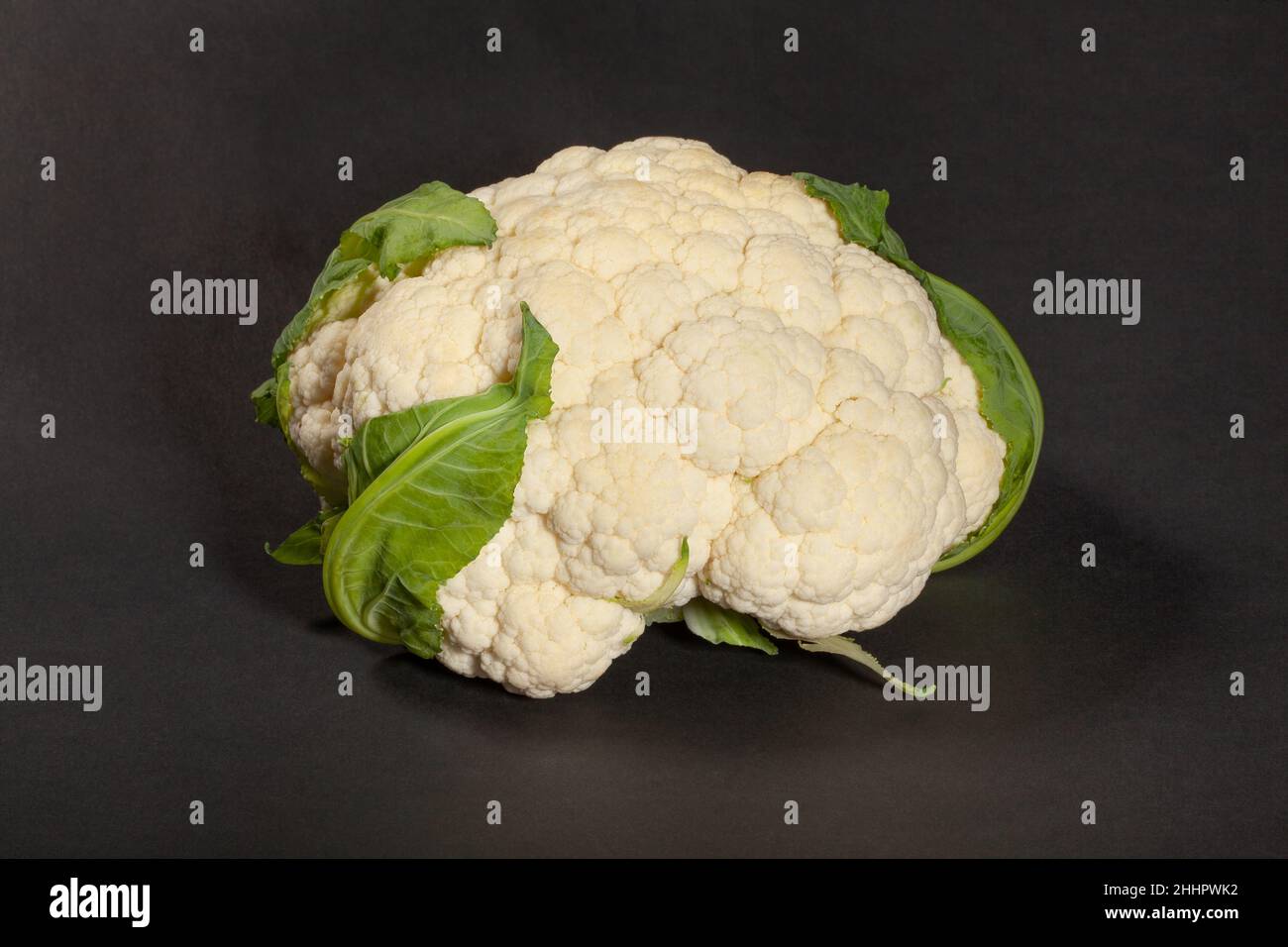 single cauliflower on black background Stock Photo