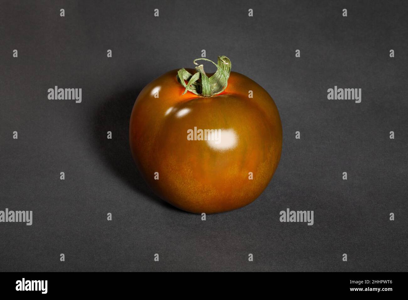 kumato tomato on black background Stock Photo