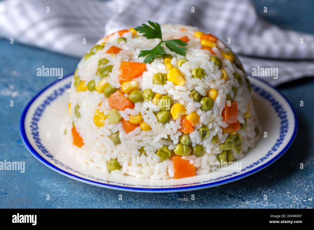 Delicious vegetable rice pilaf with green peas, carrots and sweet corn