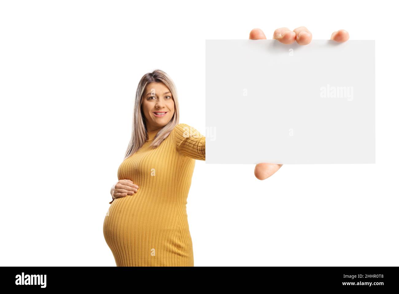 Happy pregnant woman holding a blank card in front of camera isolated on white background Stock Photo