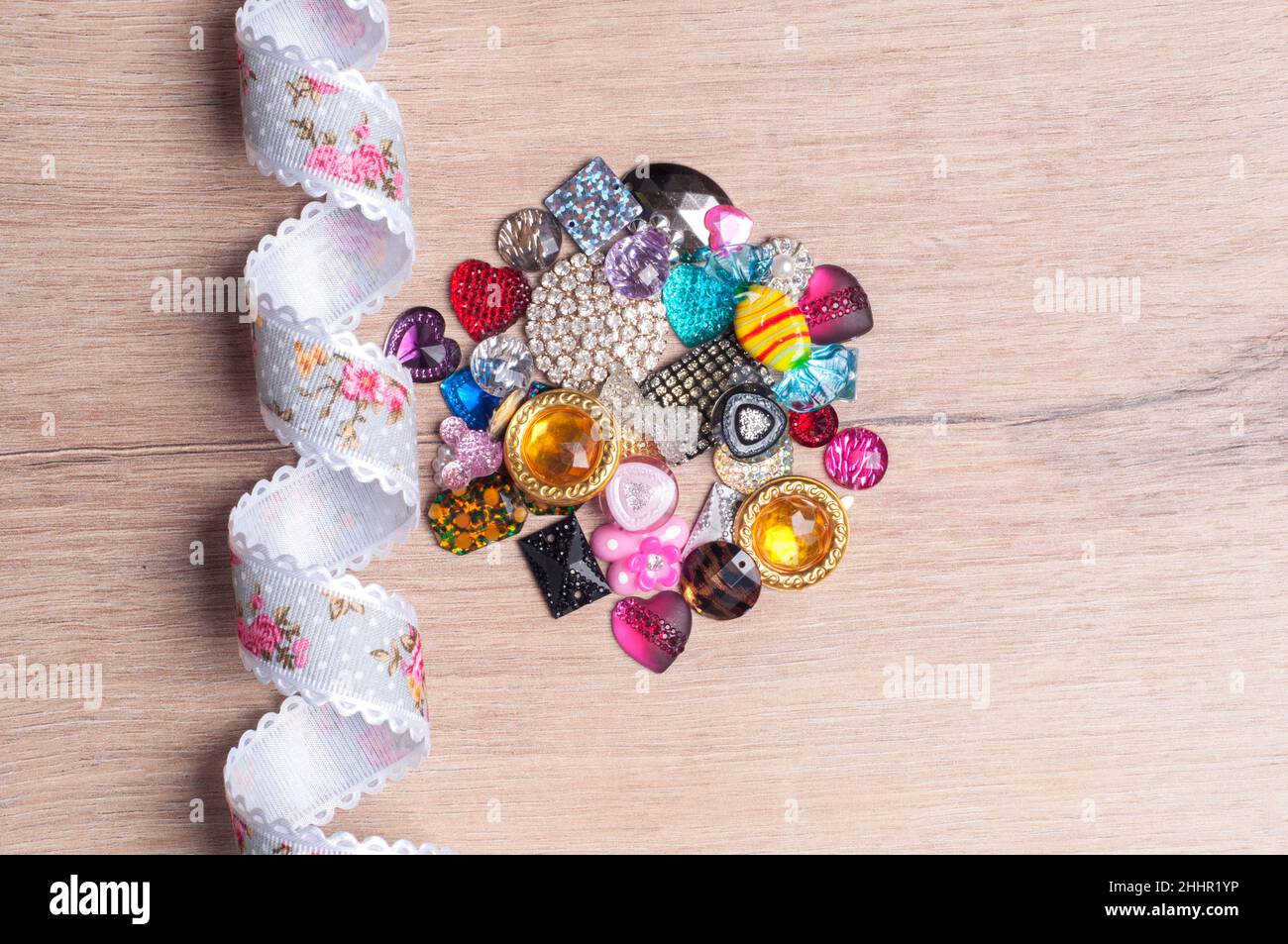 multi-colored sewn stones on a grey background.Copy Space Stock Photo
