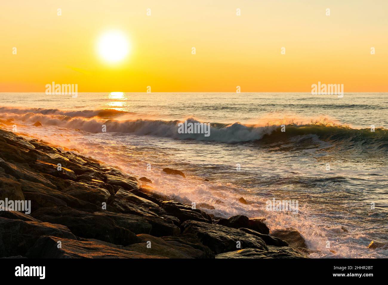 Rocky shore with sunset hi-res stock photography and images - Alamy