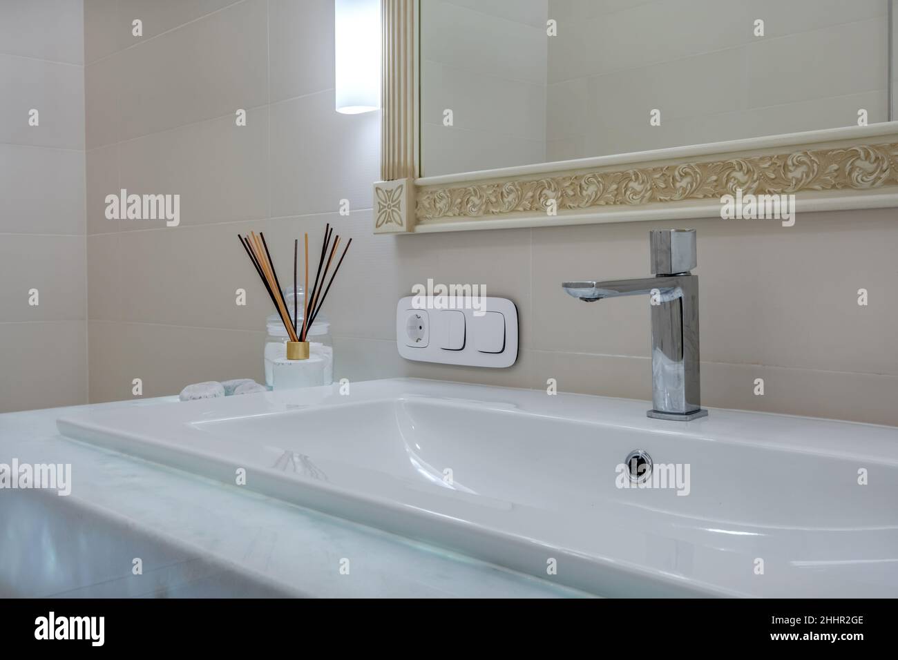 metal water tap with sink and faucet to turn on and regulate cold or