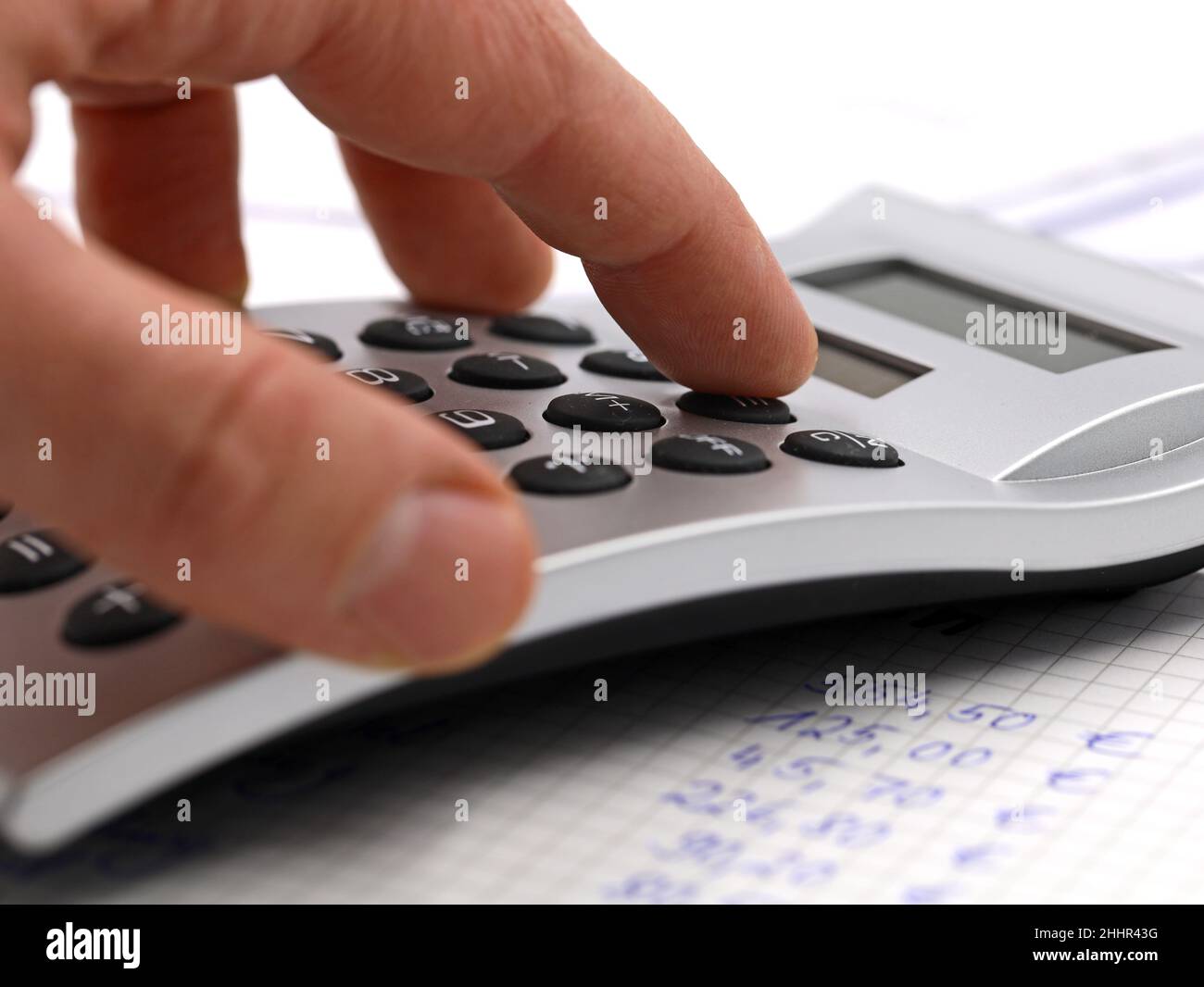 Male hand using silver calculator, close up, financial planing concept image Stock Photo