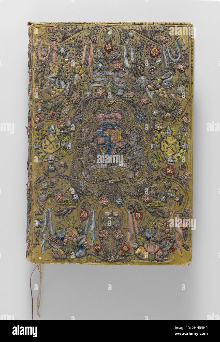 The Bible, The Book of Common Prayer, The Book of Psalms with Royal Stuart arms ca. 1624 The Book of Common Prayer printed by Robert Barker This elaborate quarto-size bookbinding is the work of a professional embroiderer and contains a rich variety of materials applied with a series of complex and imaginative techniques. The composition of the cover and matching back is dominated by a central royal blazon of the Stuart monarchy quartered with the arms of England, Scotland, and Ireland. The arms are surmounted by the royal crown and supported by a lion and unicorn engaging the shield with the O Stock Photo
