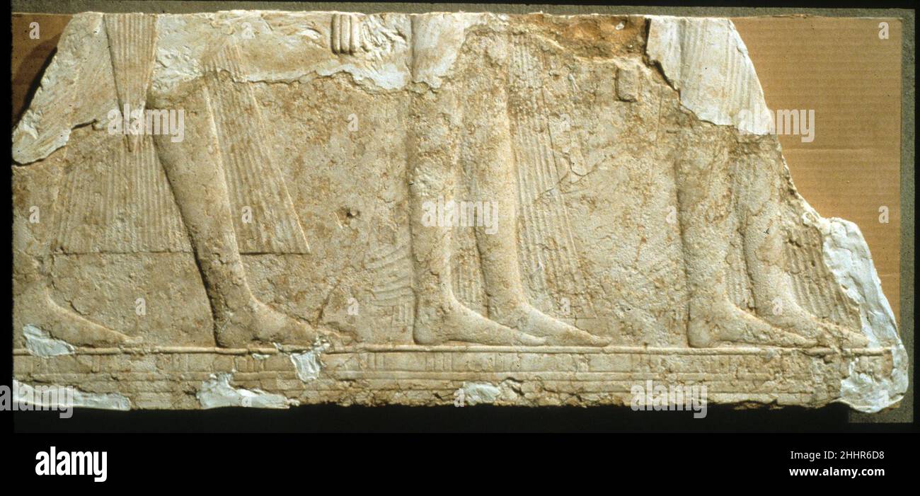 Relief from the South Wall of a Chapel of Ramesses I ca. 1295–1294 B.C. New Kingdom, Ramesside Ramesses I, first king of Dynasty 19, was a military officer from the eastern Delta. He served as a general and vizier under Haremhab, last king of Dynasty 18, and was designated by him as his successor. Probably quite old when he became king, most of his monuments were finished by his son, Seti I.The south wall, shown here, depicts Ramesses I and his family presenting offerings to Osiris. The upper register (now lost) showed Ramesses leading four young bulls to 'Osiris Onnophris.' In the lower regis Stock Photo