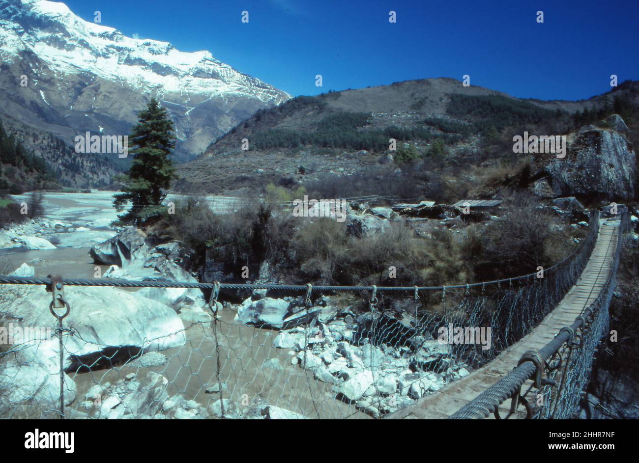 Hanging bridge in Nepal in the Himalayas mountains Annapurna Circuit Trek Stock Photo