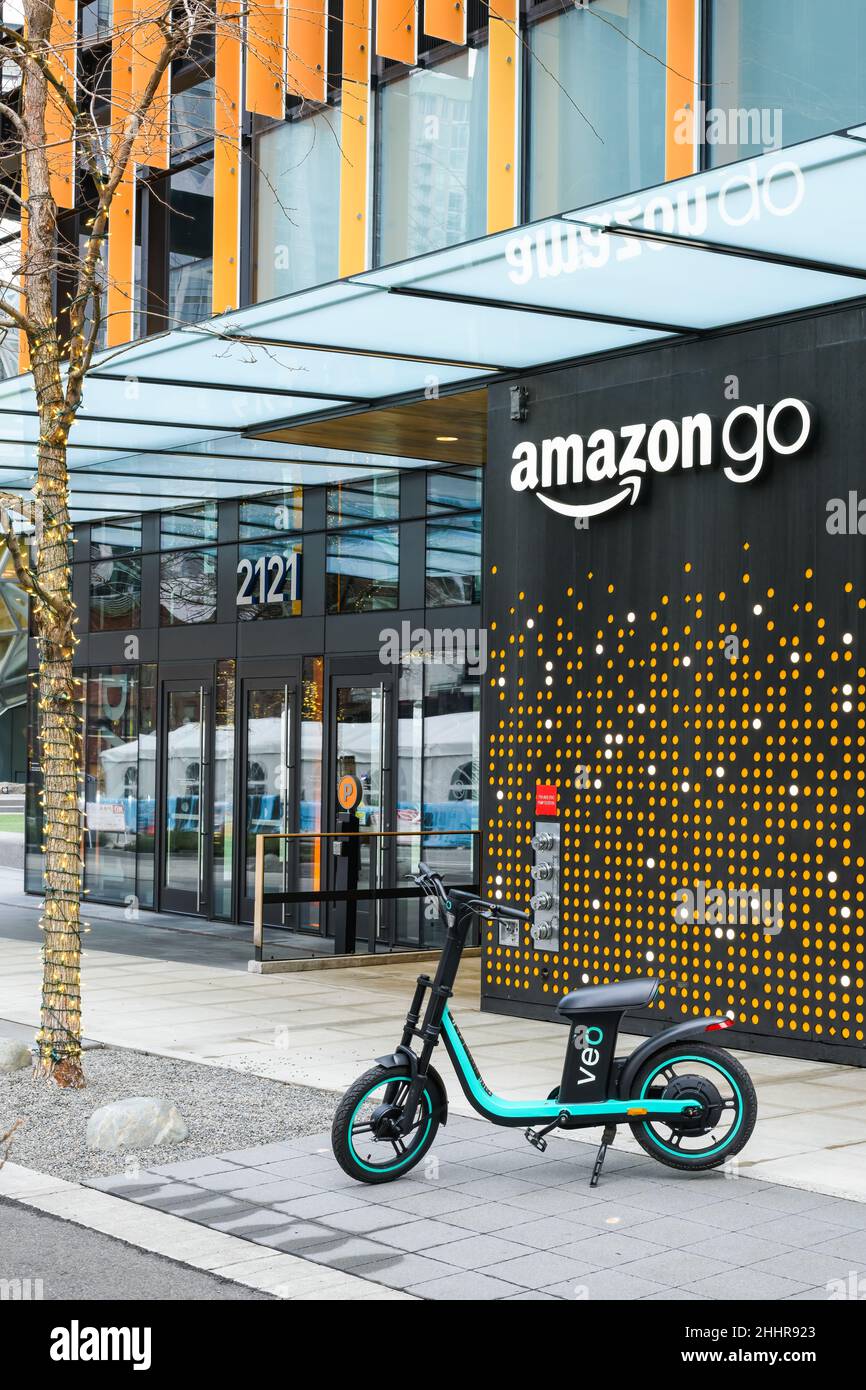 Seattle - January 22, 2022; A Veo Cosmo E-Bike parked outside an Amazon Go store in downtown Seattle Stock Photo