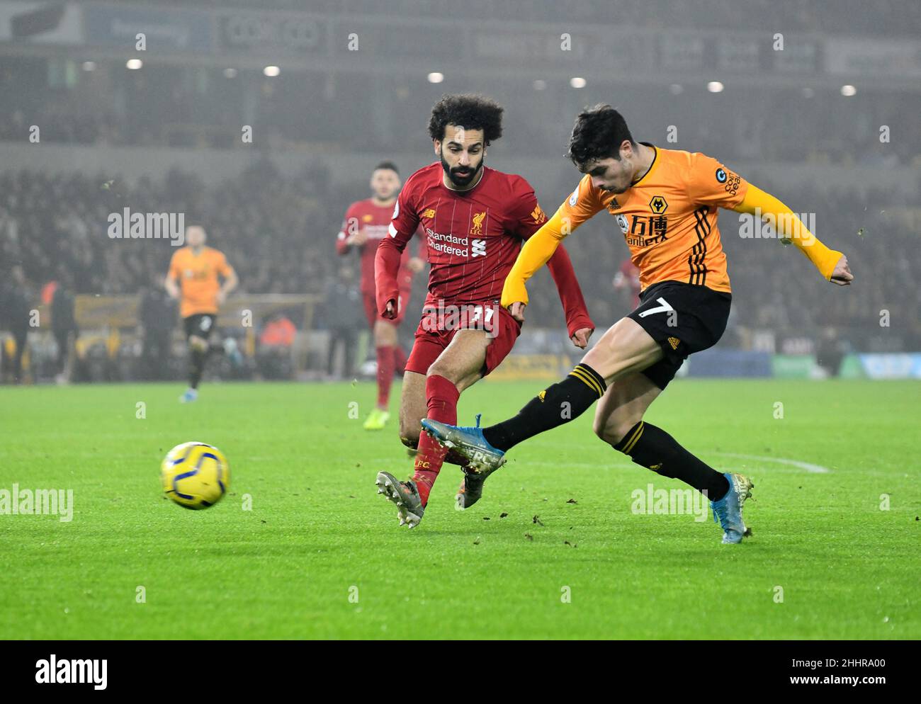 Wolves footballer Pedro Neto and Mohamed Salah of Liverpool. Wolverhampton Wanderers v Liverpool at Molineux Stadium 23/01/2020 Stock Photo
