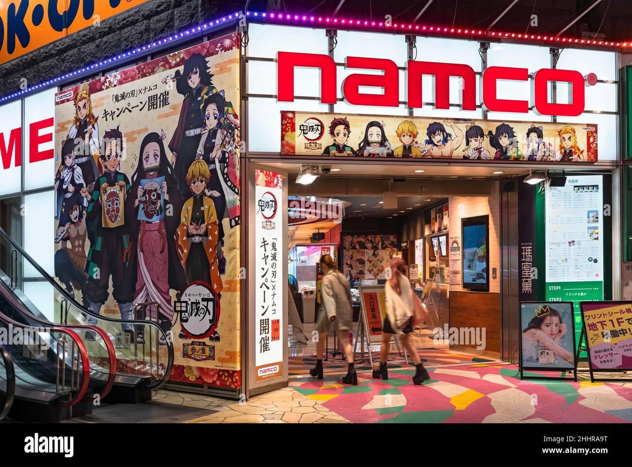 tokyo, japan - october 27 2021: Ikebukuro NAMCO video game arcades and campaign poster and banner depicting characters of Japanese manga and anime Kim Stock Photo