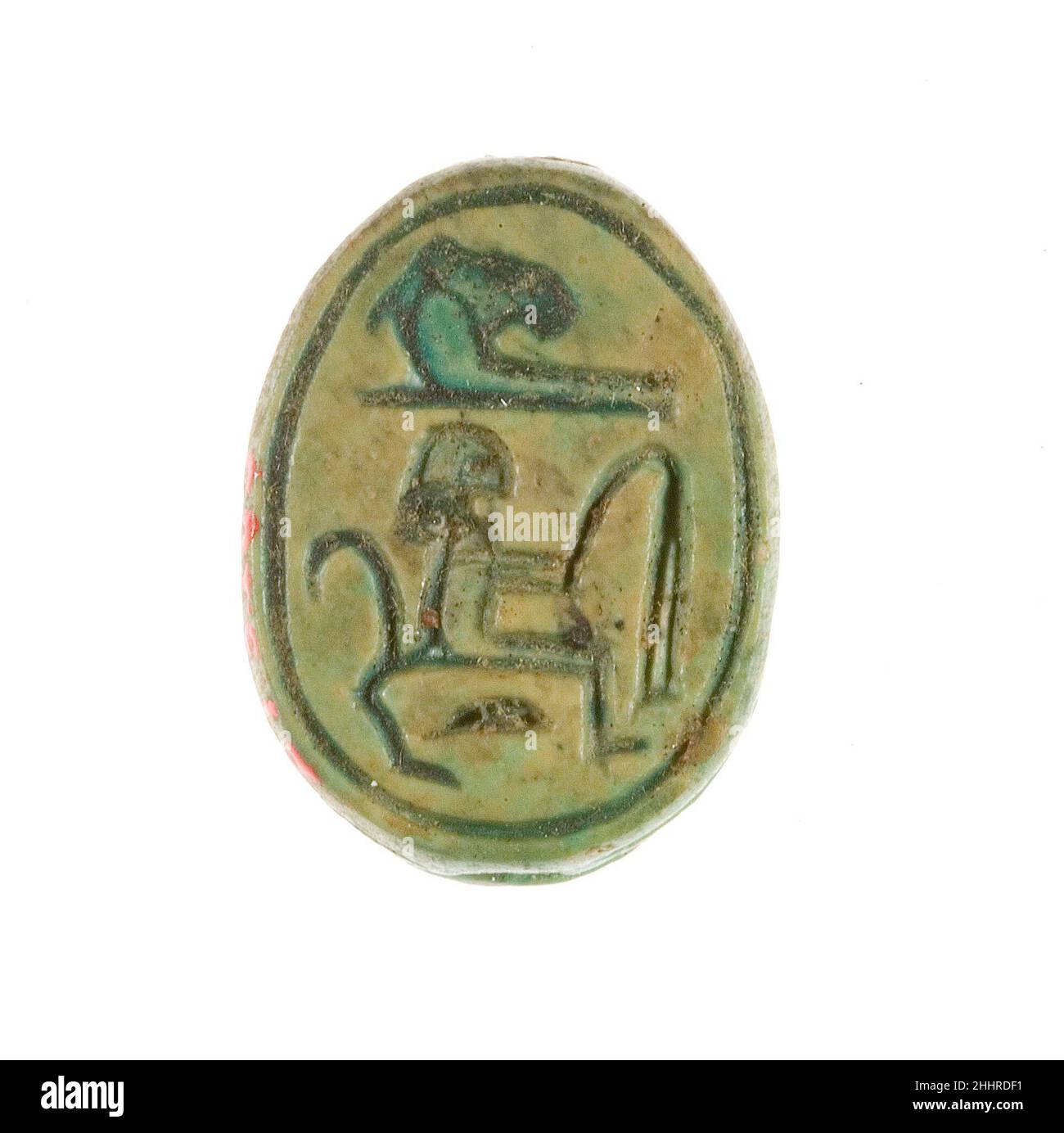 Scarab Inscribed for Hatshepsut ca. 1479–1458 B.C. New Kingdom This scarab was discovered in one of the foundation deposits along the front wall of the lower court of Hatshepsut's funerary temple at Deir el-Bahri. It's base is inscribed with her personal name (Hatshepsut). A similar version of the same inscription may be found on another scarab (27.3.166), but the backs of the two scarabs are quite different.. Scarab Inscribed for Hatshepsut. ca. 1479–1458 B.C.. Steatite (glazed). New Kingdom. From Egypt, Upper Egypt, Thebes, Deir el-Bahri, Temple of Hatshepsut, Foundation Deposit 9 (I), MMA e Stock Photo
