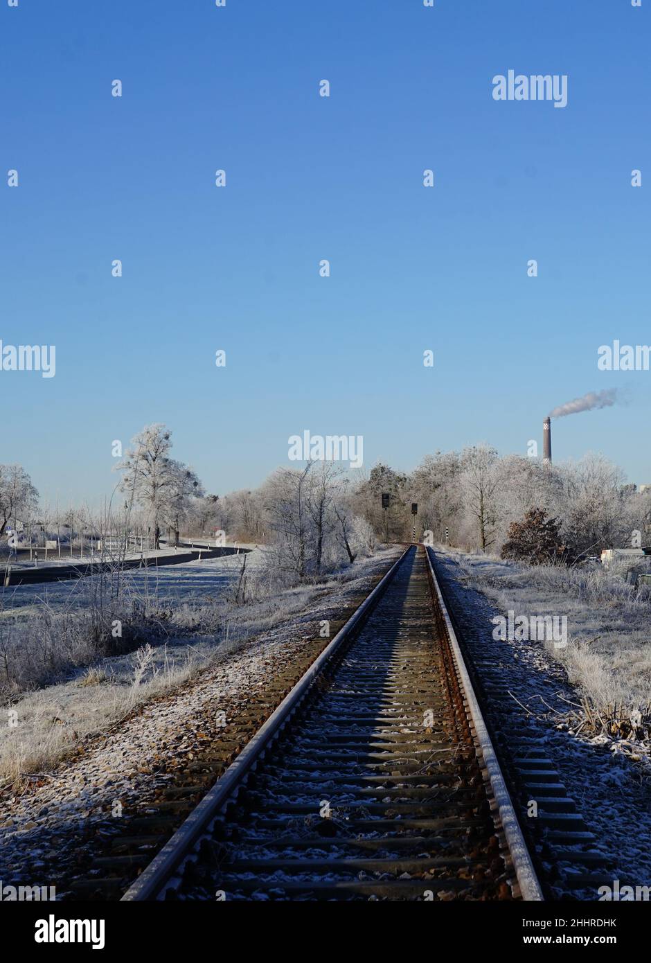 Railway line in Brandenburg, single-track, on a winter day Stock Photo