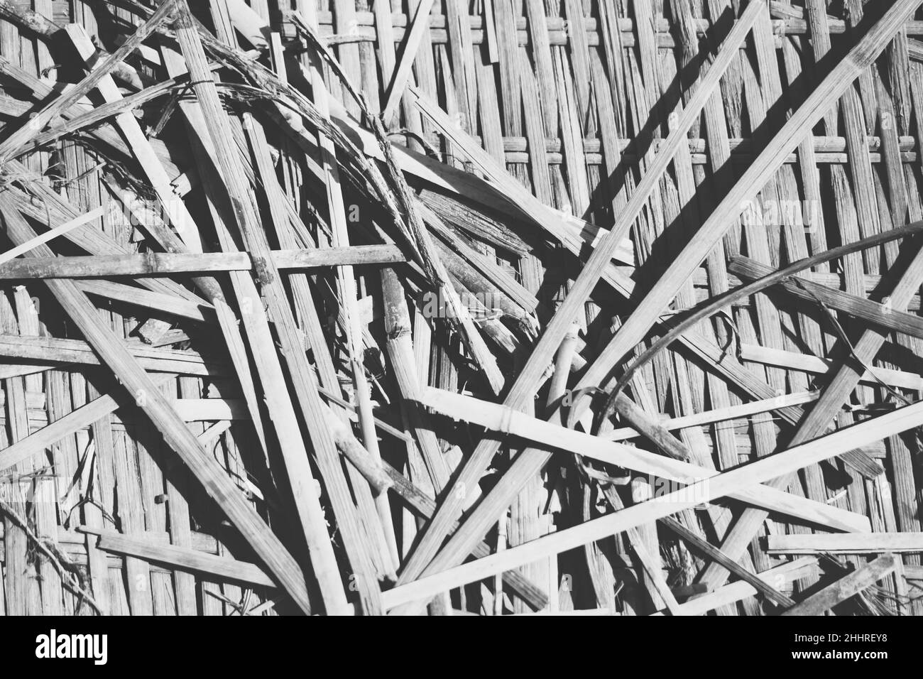 Real nature abstract background. Bamboo straws weaving texture mat, light gray black white colour vintage effect. Calm warm simple life style mood Stock Photo