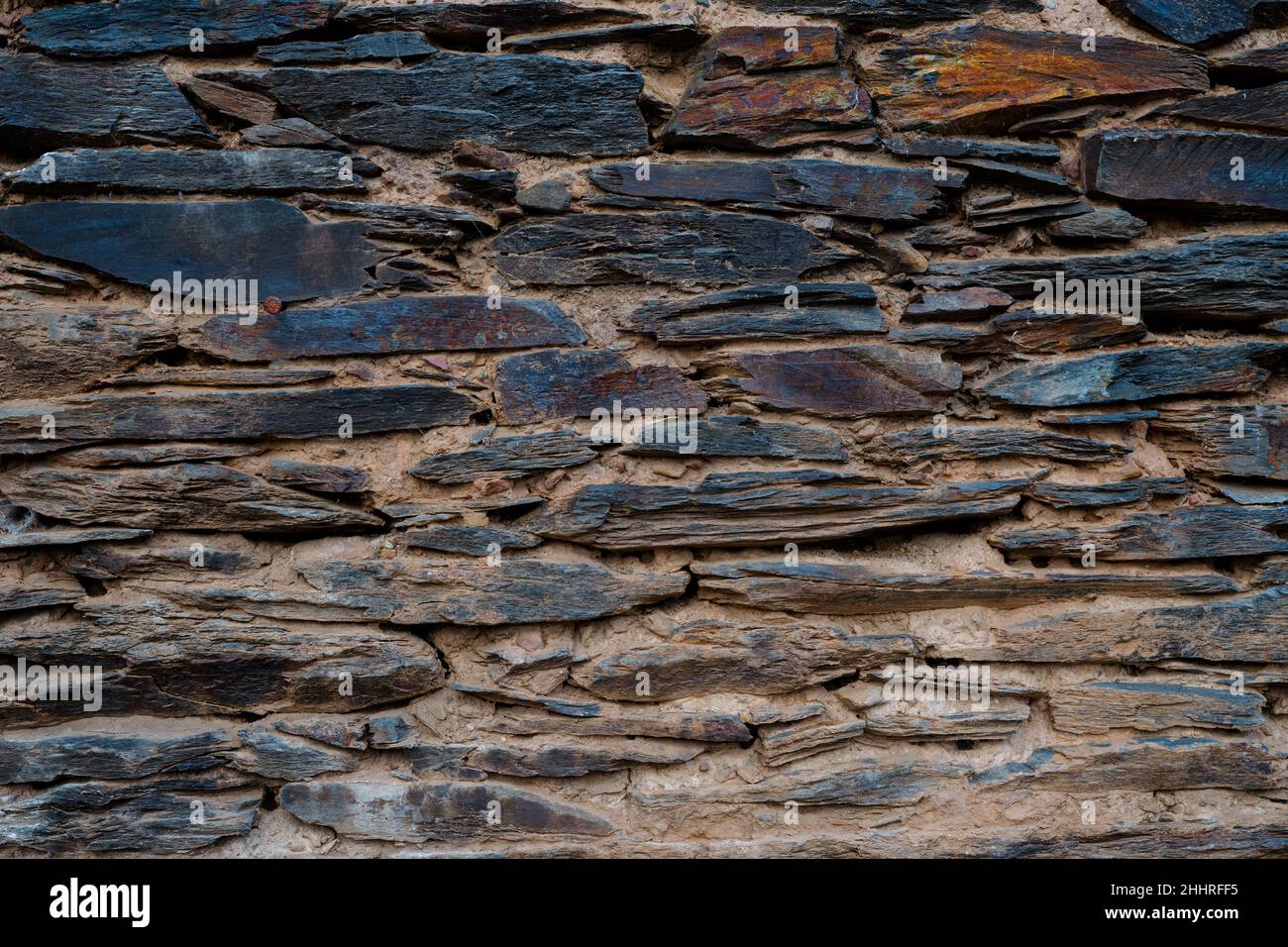 Stone and clay wall texture. Stone background with clay. Stock Photo