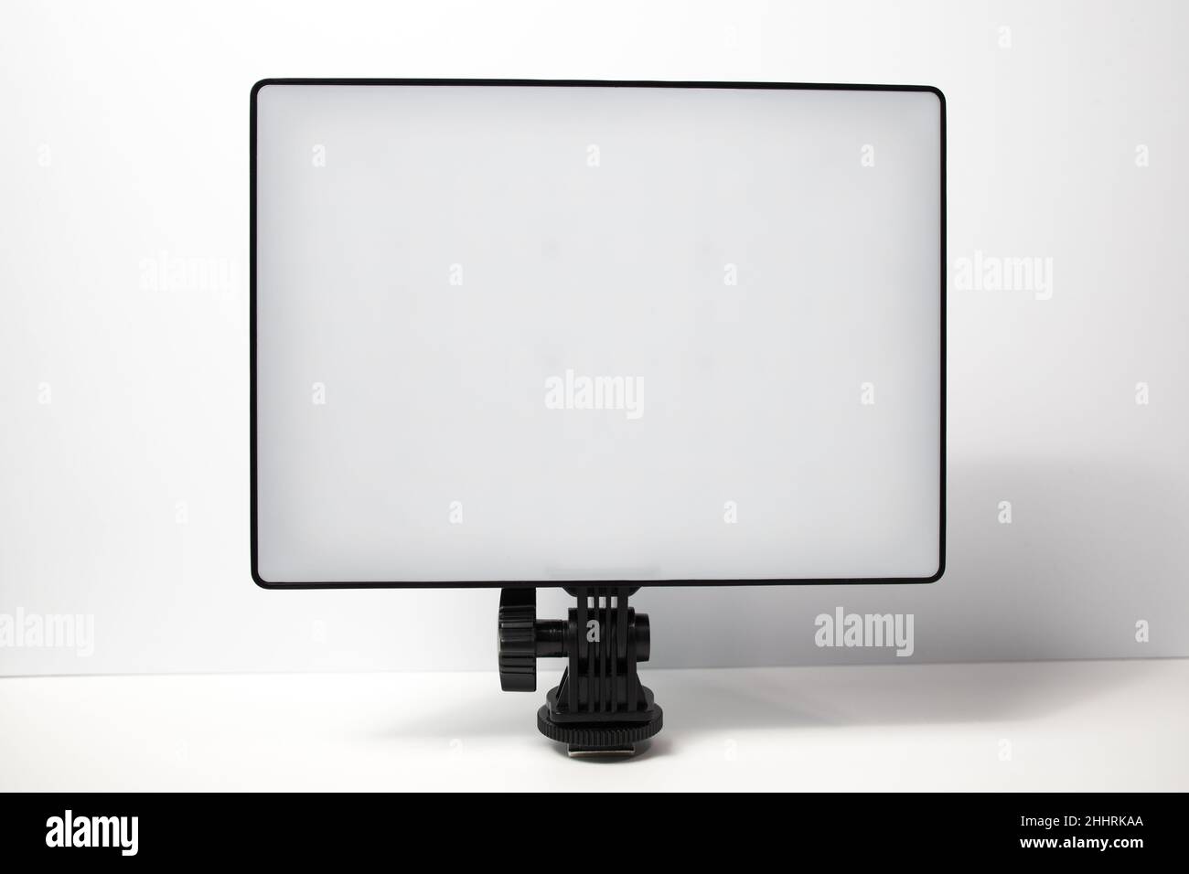 A Led light panel on a white background. Portable lighting for photography and videography. Stock Photo