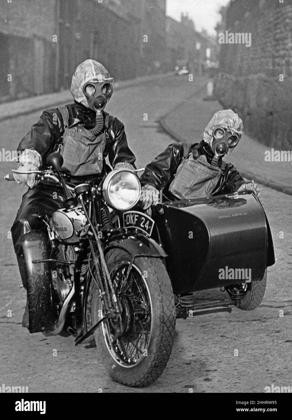 Air raid wardens seen here riding on a motorbike and sidecar during an air raid gas exercise on Merseyside 18th January 1938 Stock Photo