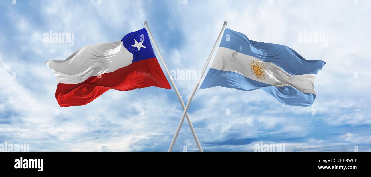 crossed national flags of Chile and Argentina flag waving in wind at ...