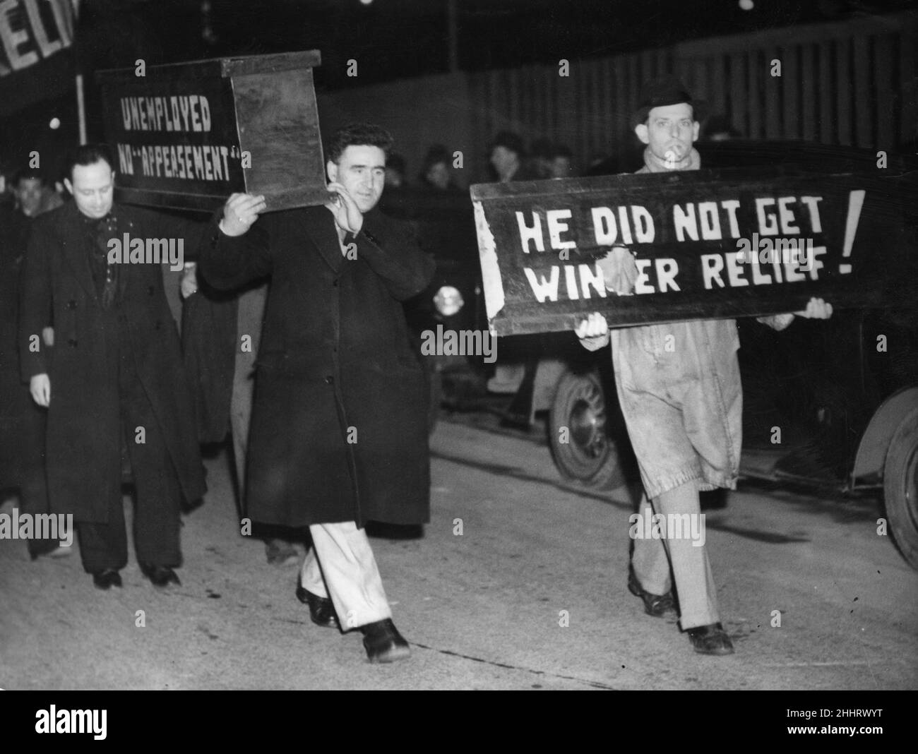 Headed by a propaganda 'coffin' delegates to the National Unemployed Workers Movement (NUWM), who were in conference at Blackpool march through the streets of Blackpool. 28th January 1939 Stock Photo