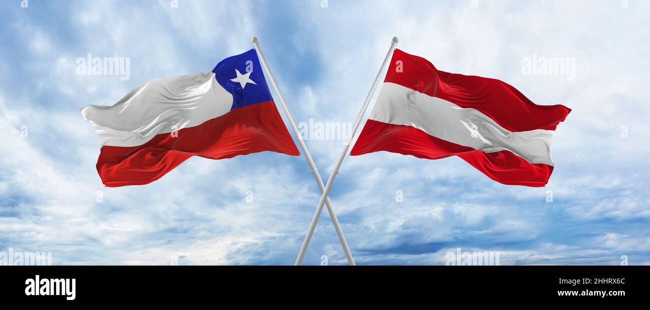 crossed national flags of Chile and Austria flag waving in wind at ...